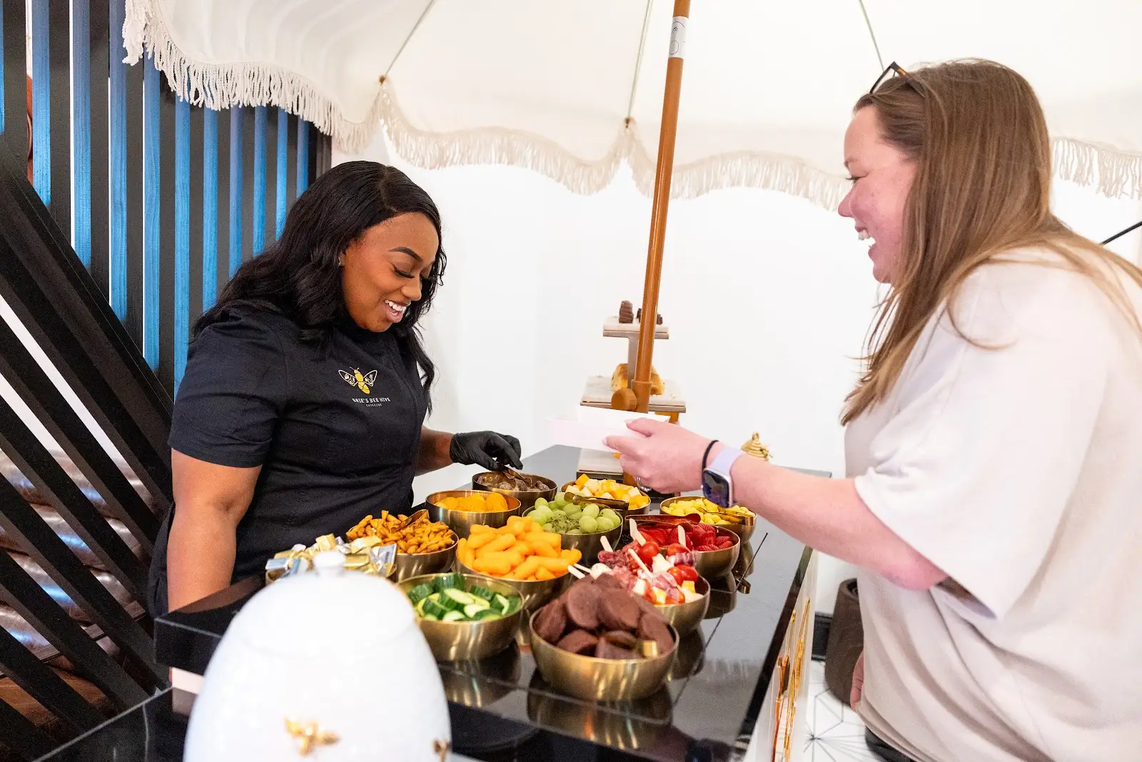 Brie serving guests at an event
