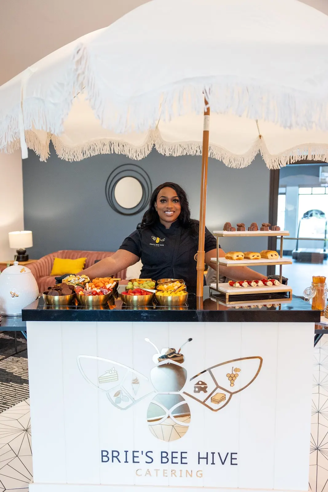 Brie behind the signature experience cart